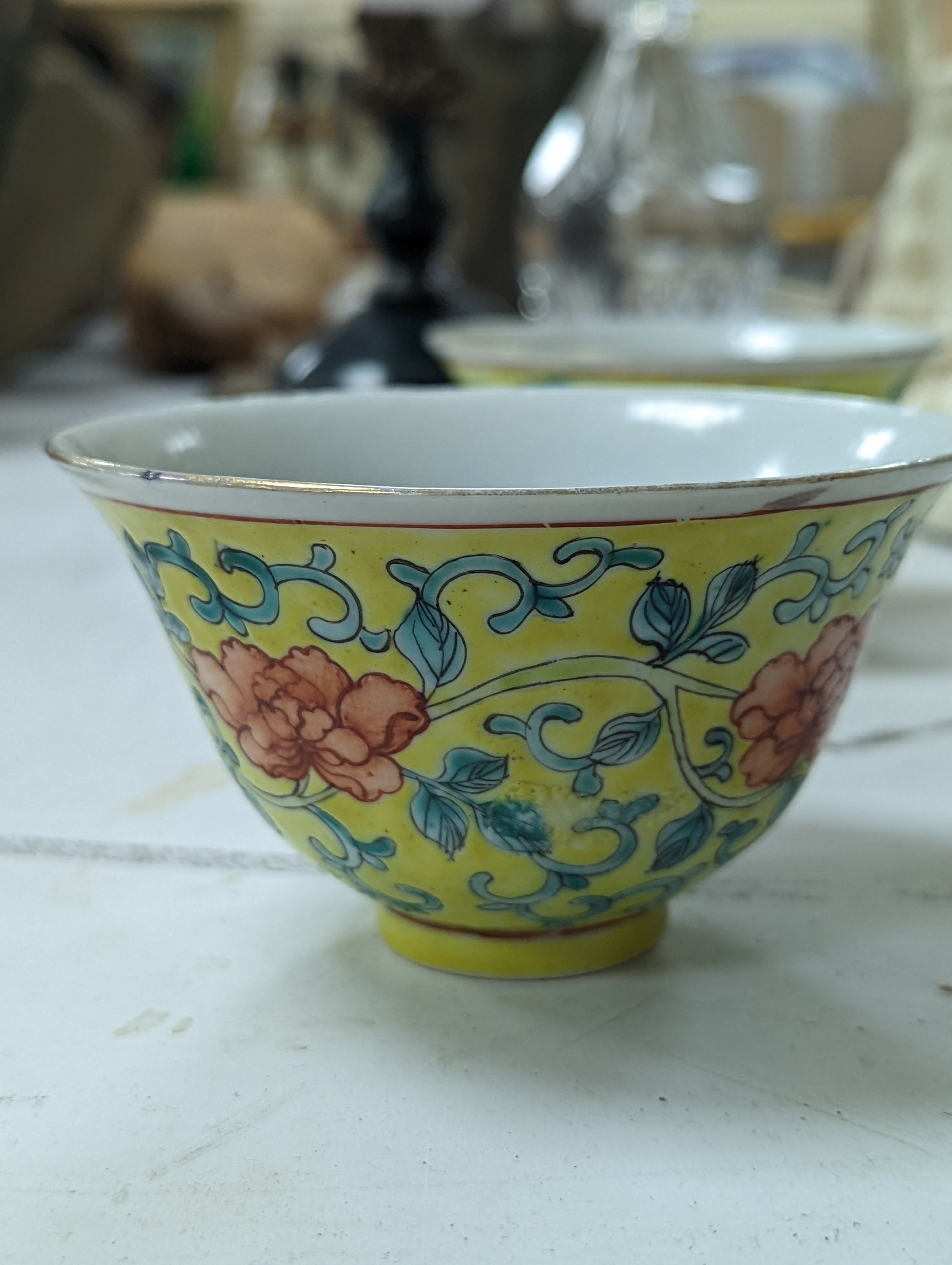 A group of Chinese porcelain, 19th /20th century, to include a pair of yellow ground bowls, 10.8 cm diameter, a blue and white vase, Xuande mark, a similar bowl and vase, and a champleve enamel bronze koro and cover